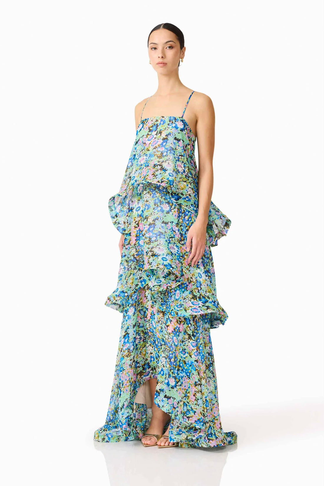 Side view of woman wearing the Armani Tiered Maxi Dress in Blue Floral by ELLIATT