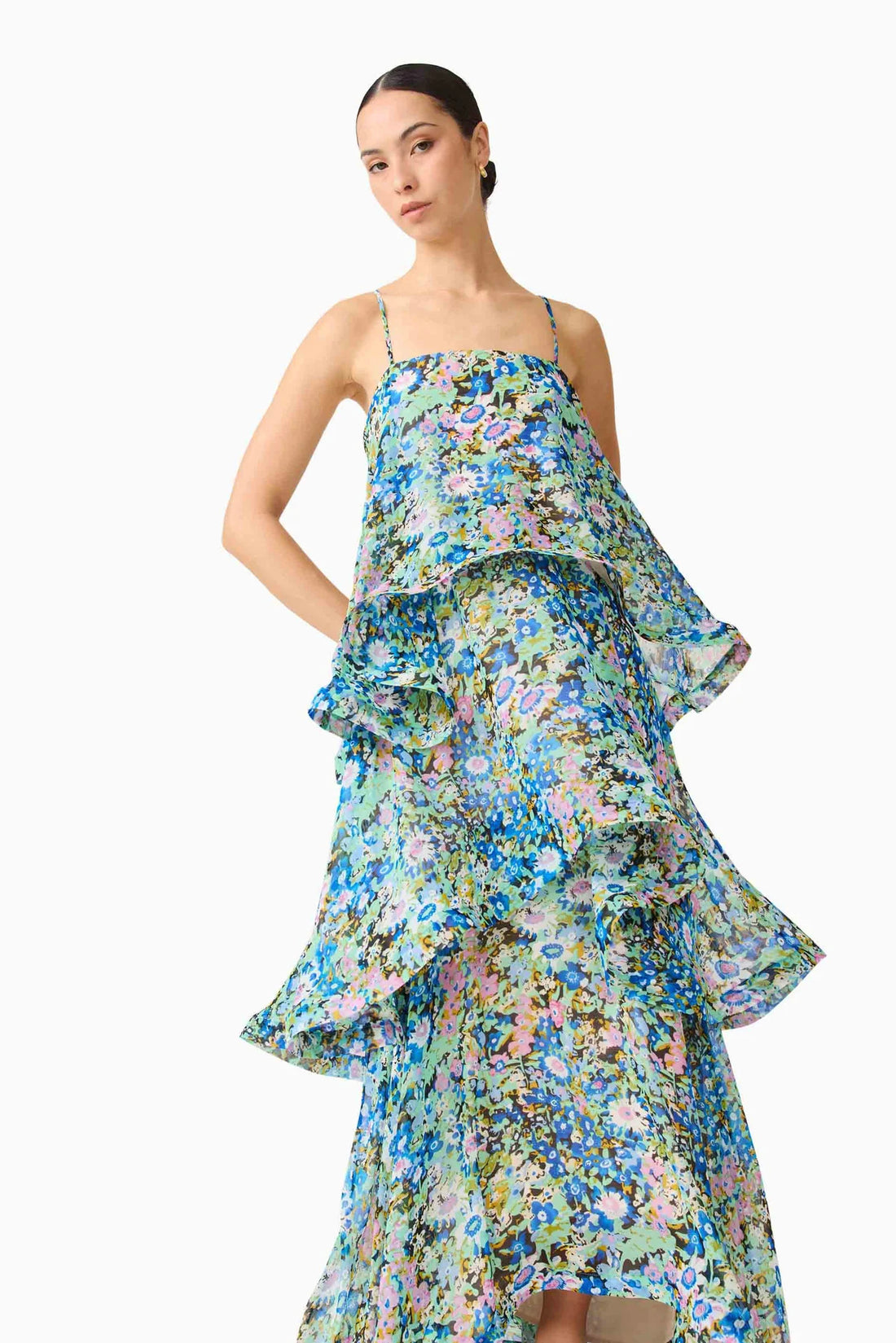 Detail of woman wearing the Armani Tiered Maxi Dress in Blue Floral by ELLIATT