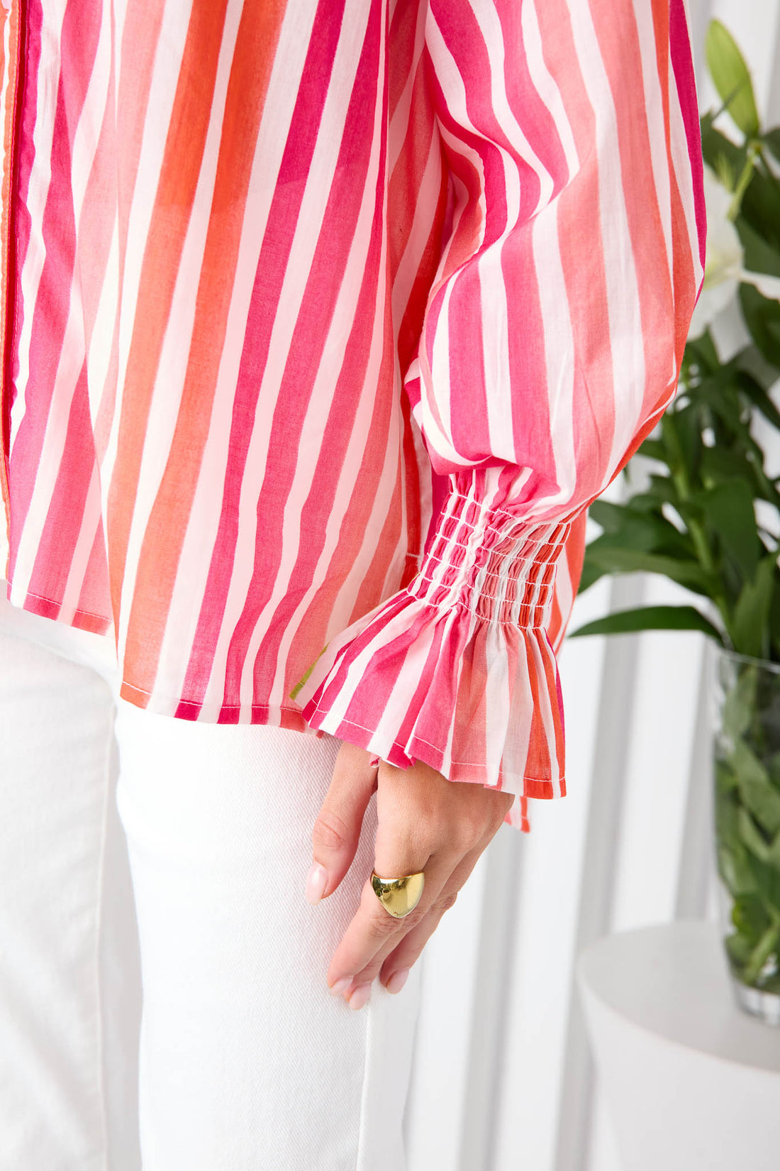 Detail of pink stripe cotton shirt ruffle cuffs