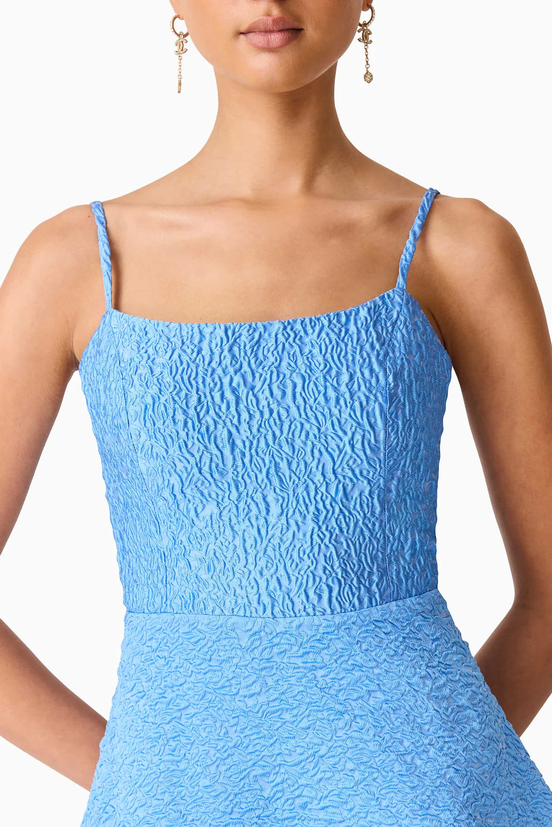 Detail view of woman wearing the ELLIATT Briallen Jacquard Gown in blue