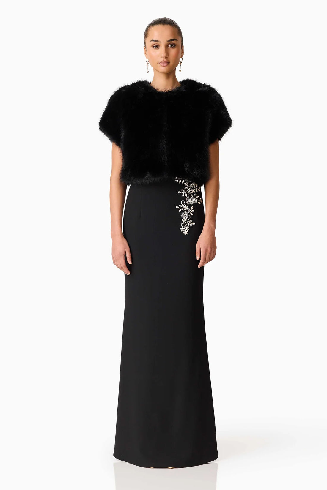 Woman wearing the ELLIATT Veda Gown with diamante embellishments and the Lucyna short sleeve bolero in black faux fur