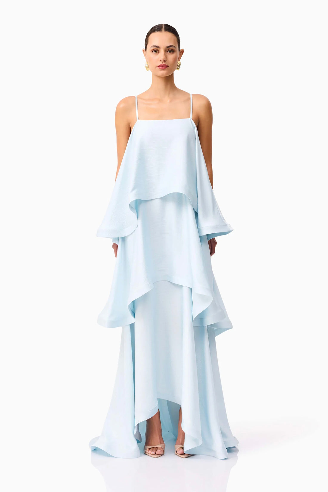 Front full length view of woman wearing the ELLIATT Tilly Tiered Maxi Dress in pale blue