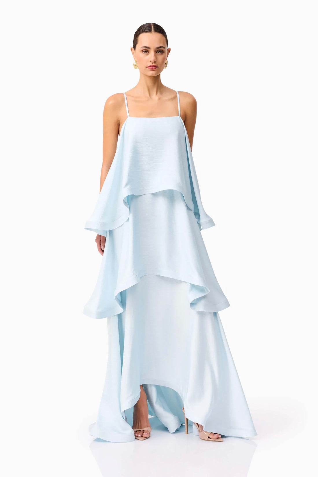 Front full length view of woman wearing the ELLIATT Tilly Tiered Maxi Dress in pale blue