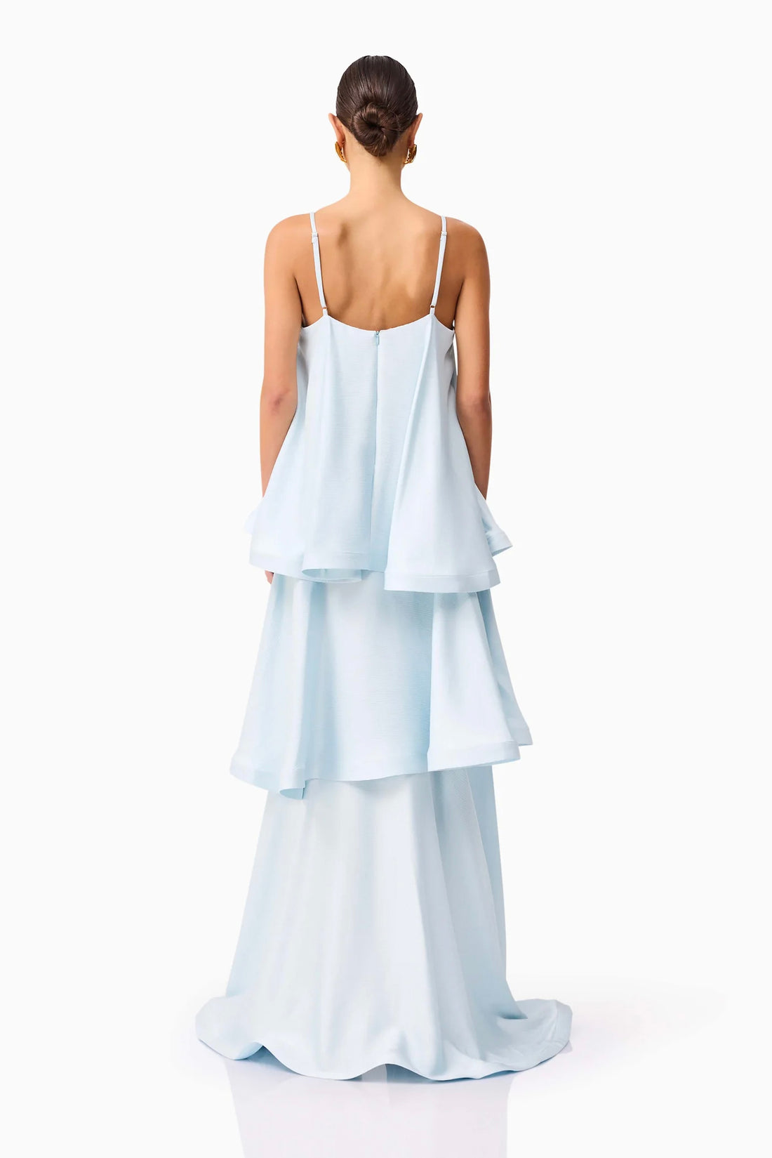 Back view of woman wearing the ELLIATT Tilly Tiered Maxi Dress in pale blue