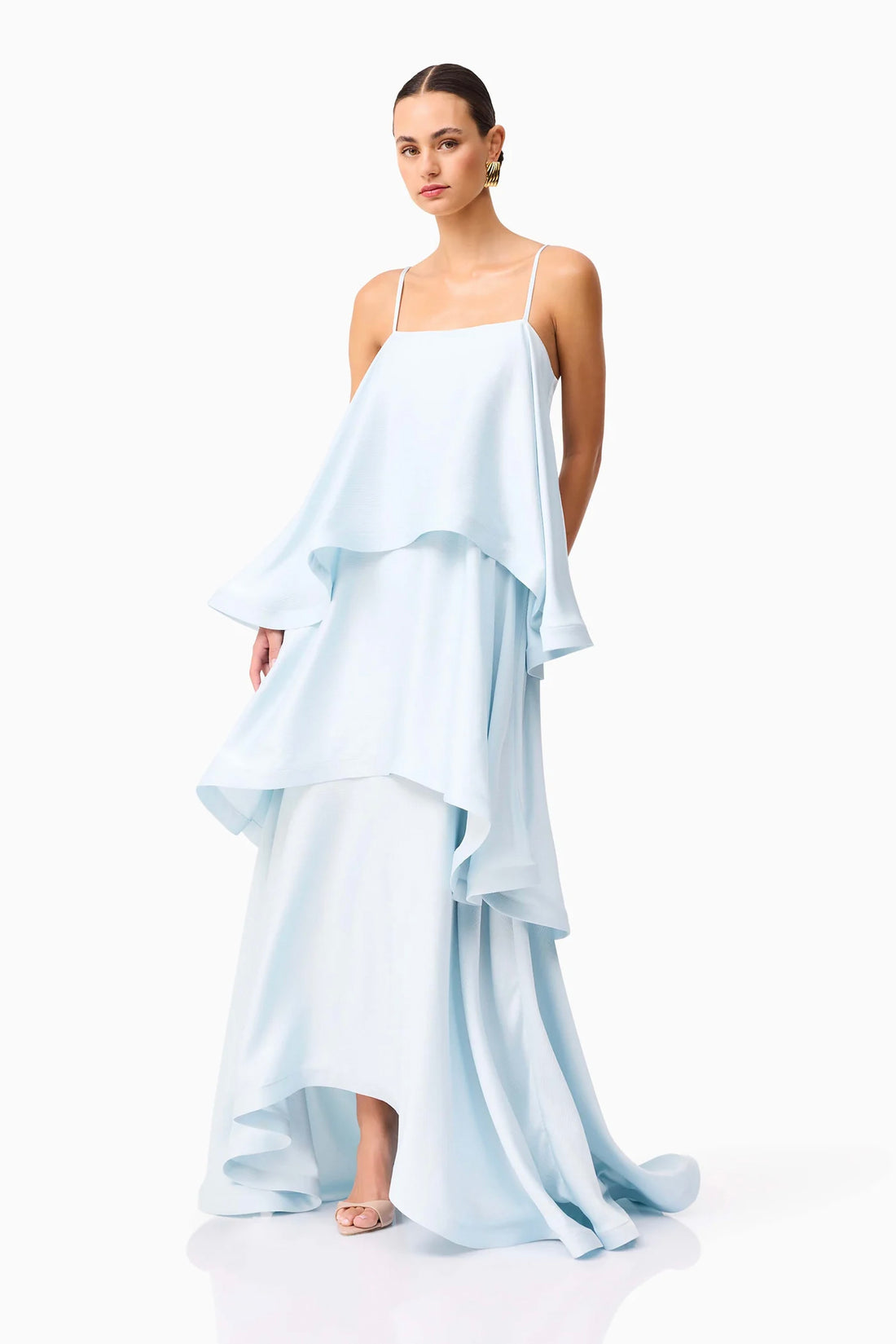 Front full length view of woman wearing the ELLIATT Tilly Tiered Maxi Dress in pale blue