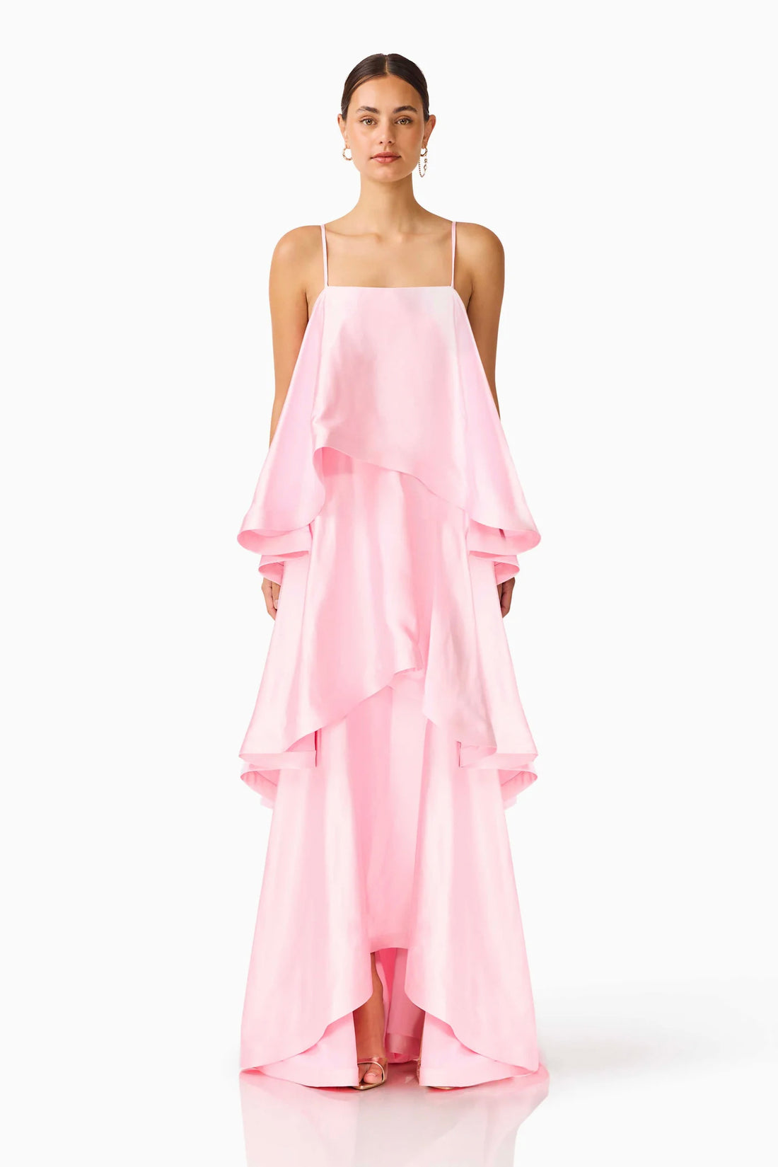 Woman wearing the ELLIATT Tilly Tiered   Maxi Dress in pale pink evening gown on a white background