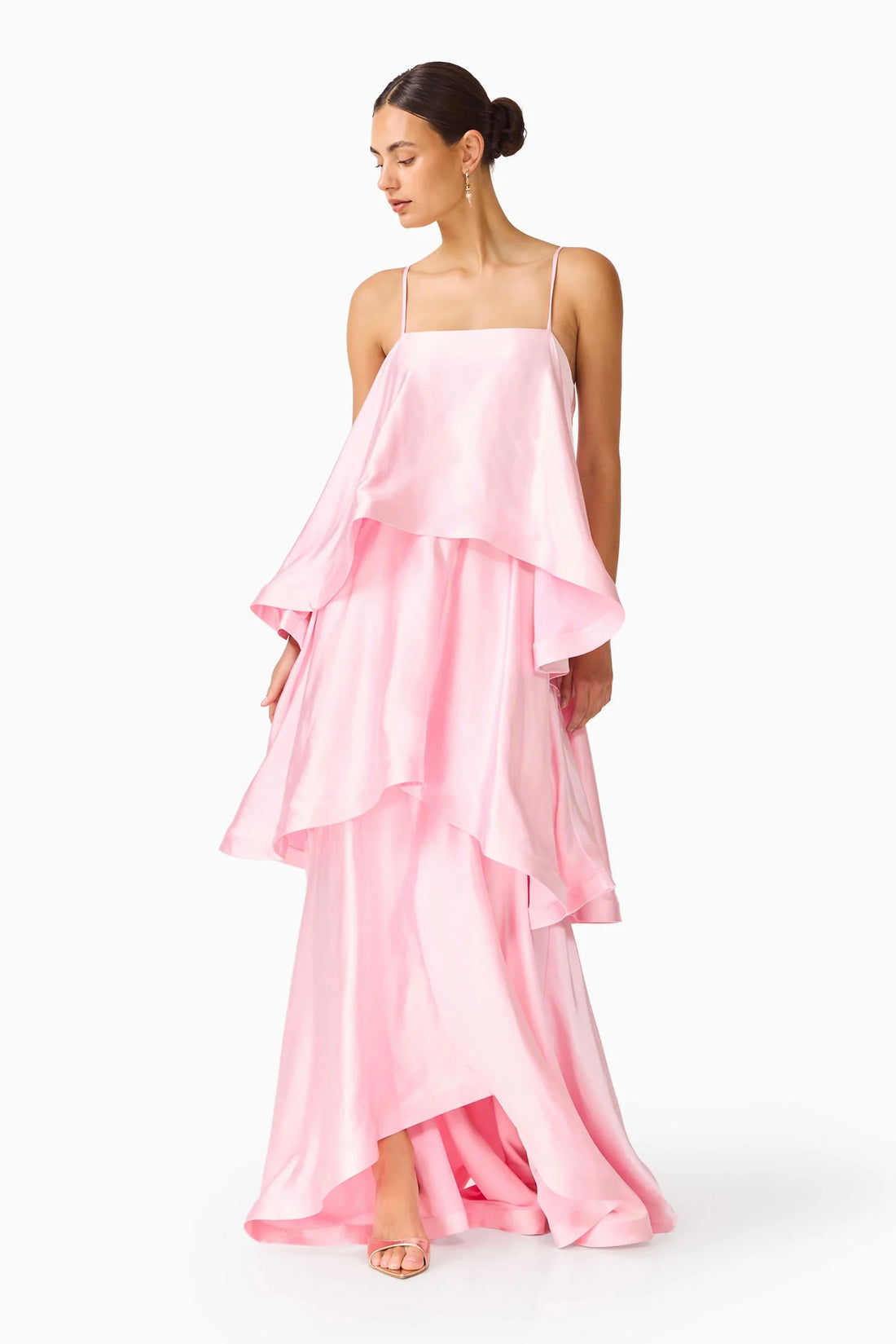 Woman wearing the ELLIATT Tilly Tiered   Maxi Dress in pale pink evening gown on a white background