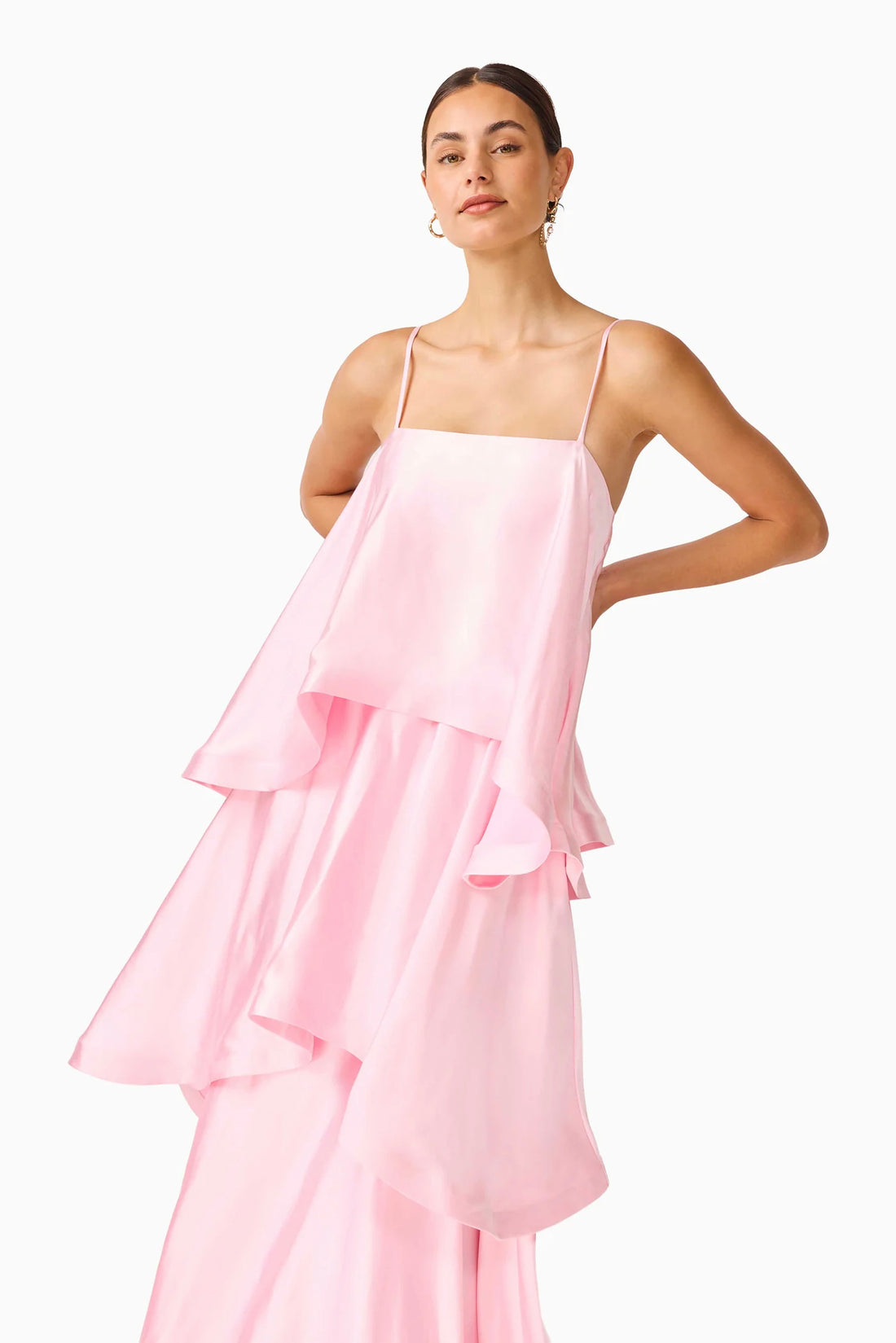 Close up of woman wearing the ELLIATT Tilly Tiered   Maxi Dress in pale pink evening gown on a white background