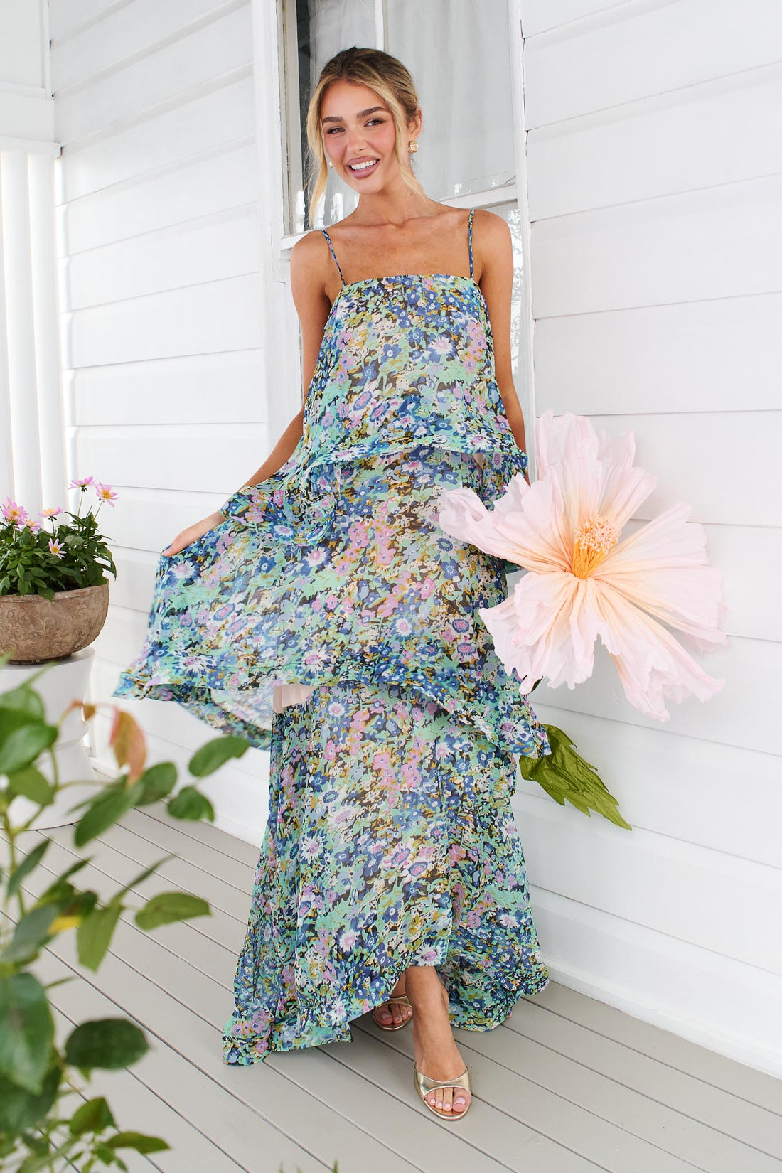 Woman wearing the Armani Tiered Maxi Dress in Blue Floral by ELLIATT