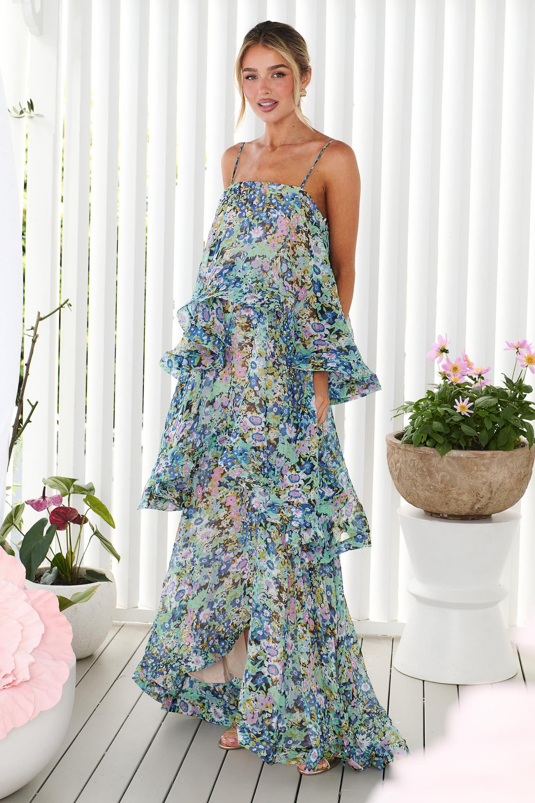 Woman wearing the Armani Tiered Maxi Dress in Blue Floral by ELLIATT