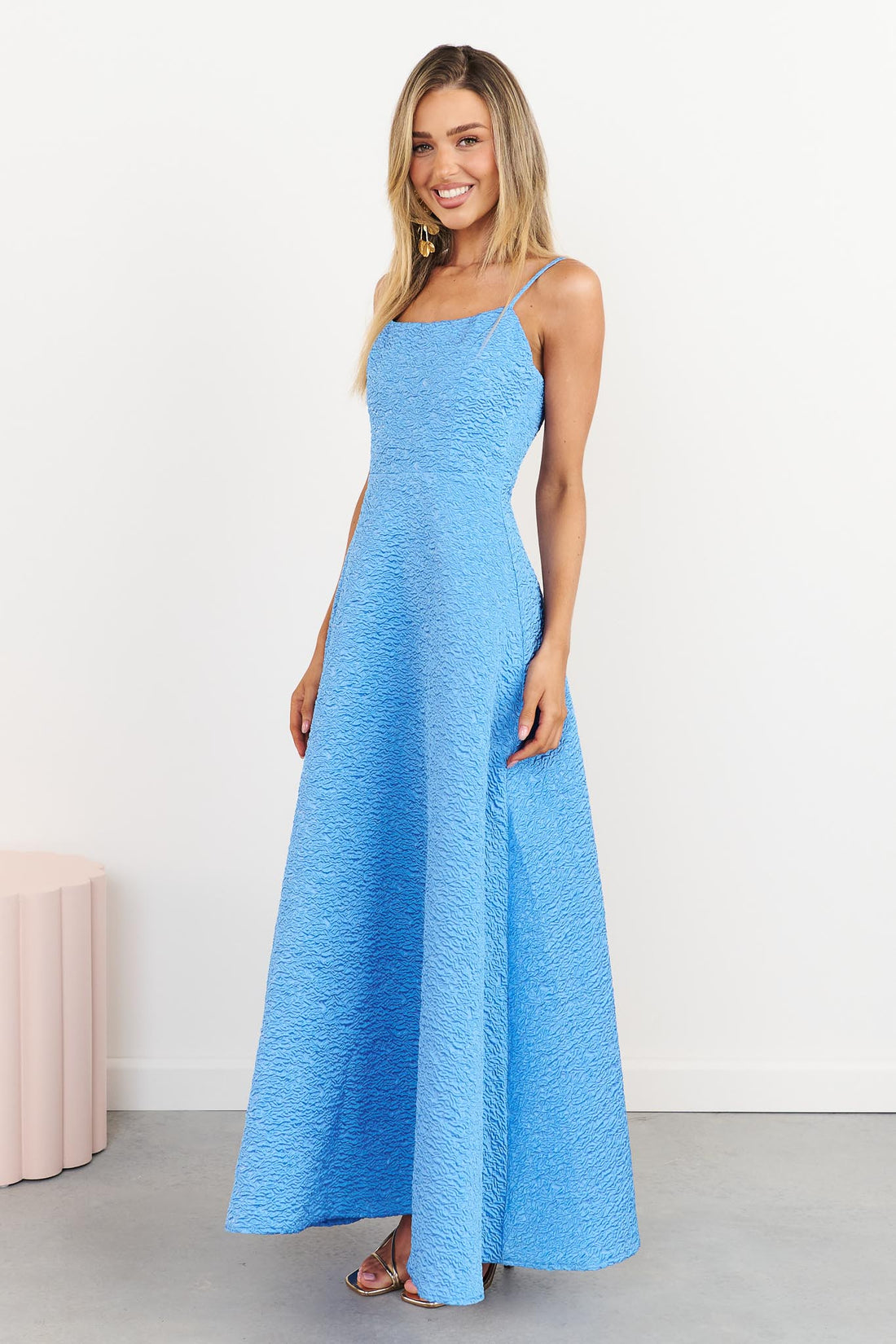Side view of woman wearing the ELLIATT Briallen Jacquard Gown in blue