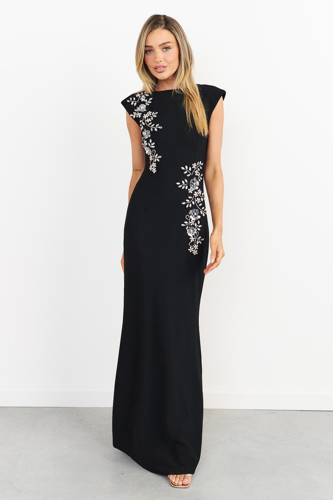 Front full length view of woman wearing the ELLIATT Veda Gown in black with diamante embellishments
