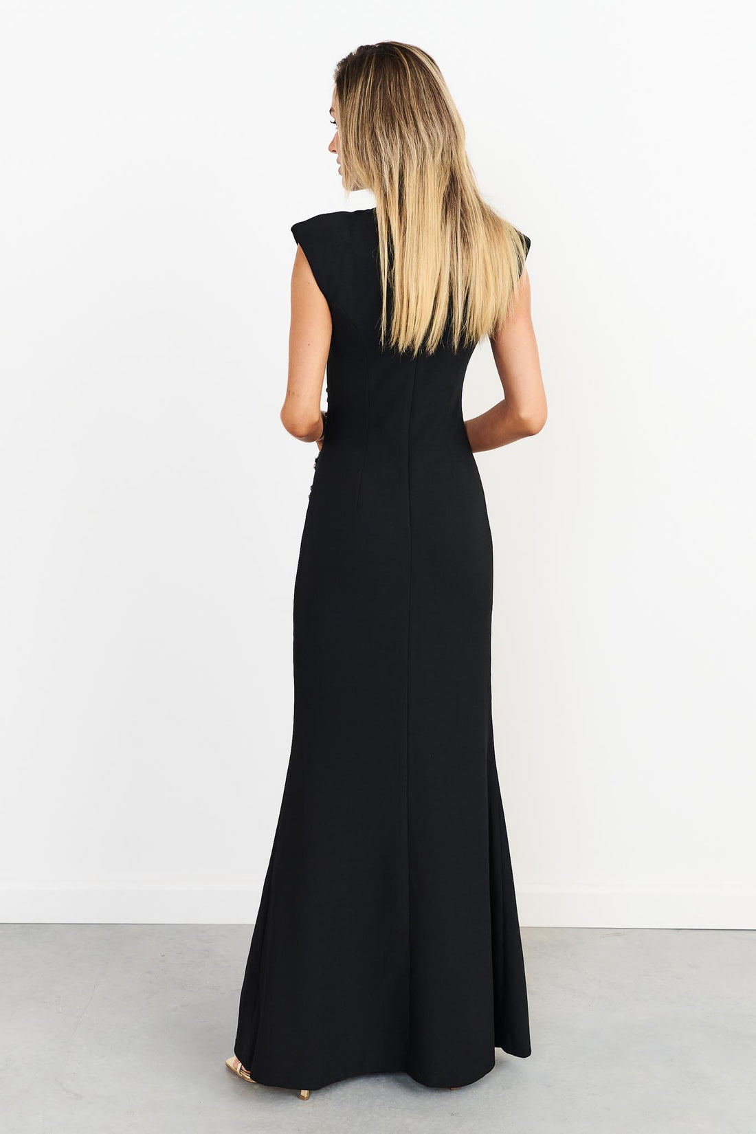 Back view of woman wearing the ELLIATT Veda Gown in black with diamante embellishments