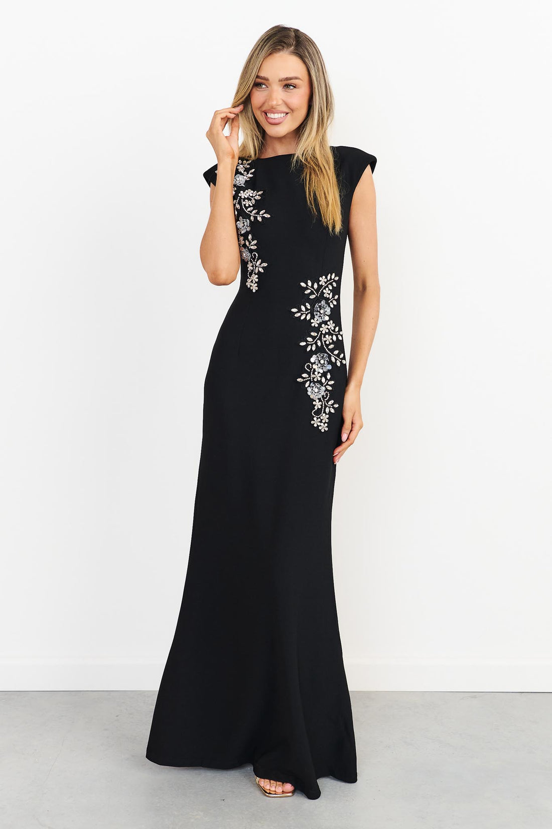 Woman wearing the ELLIATT Veda Gown in black with diamante embellishments