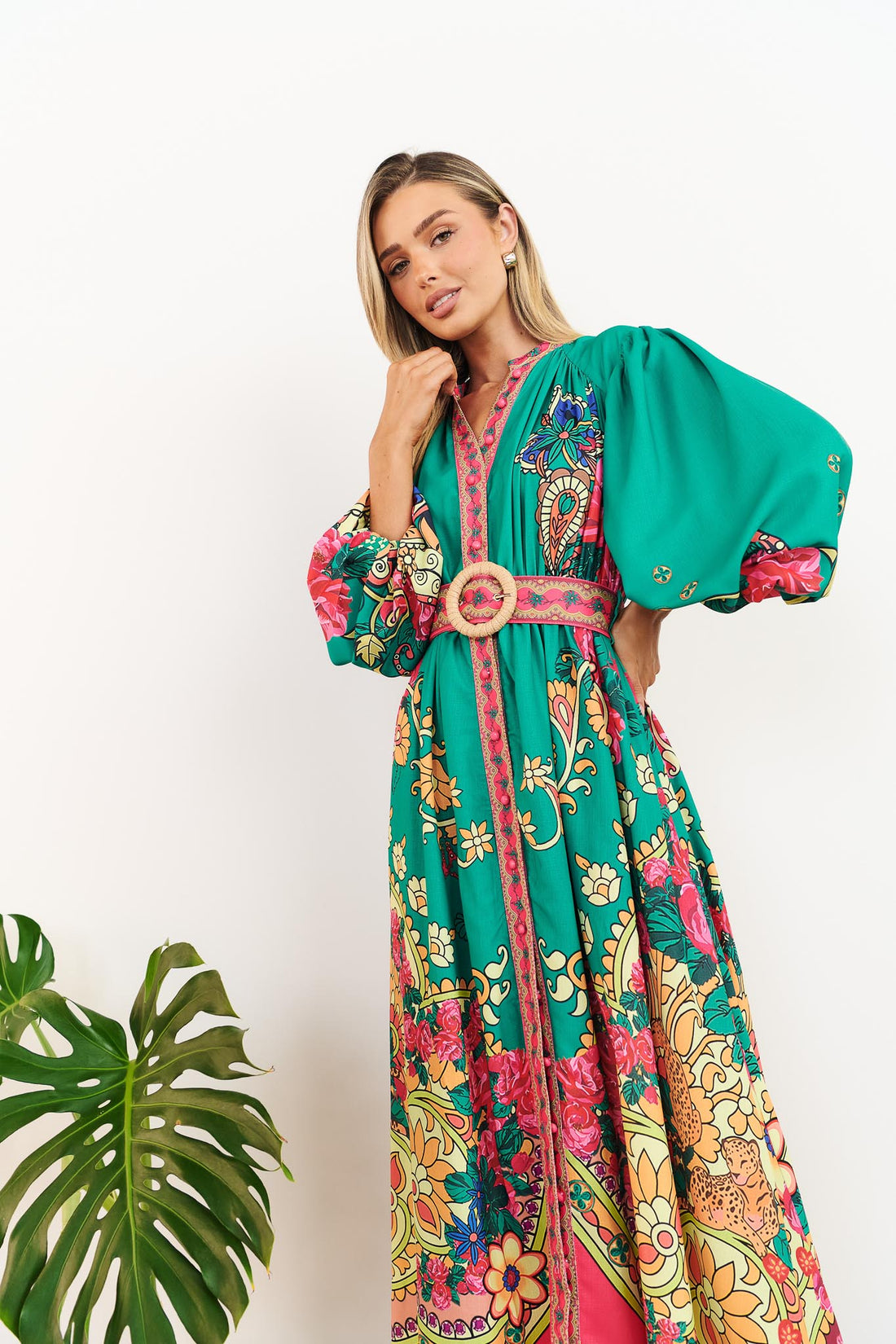 Close up view of minnie + MAXXIE Franca Maxi Dress in emerald green with paisley print and matching belt