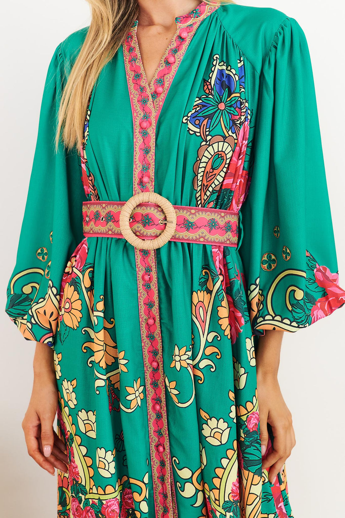 Detail of minnie + MAXXIE Franca Maxi Dress in emerald green with paisley print and woven buckle belt