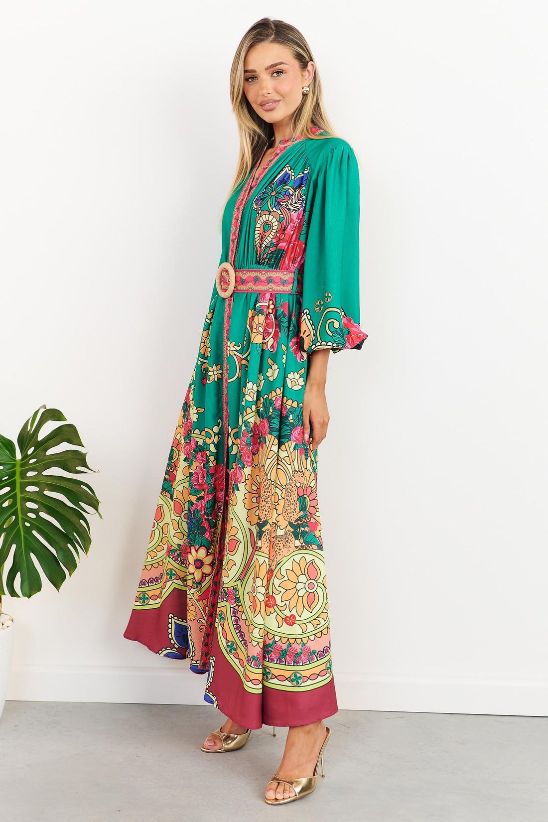 minnie + MAXXIE Franca Maxi Dress in emerald green with paisley print and matching belt, side view