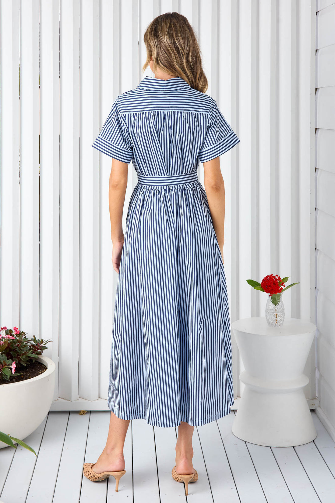Back view of navy and white stripe cotton shirt dress with waist tie