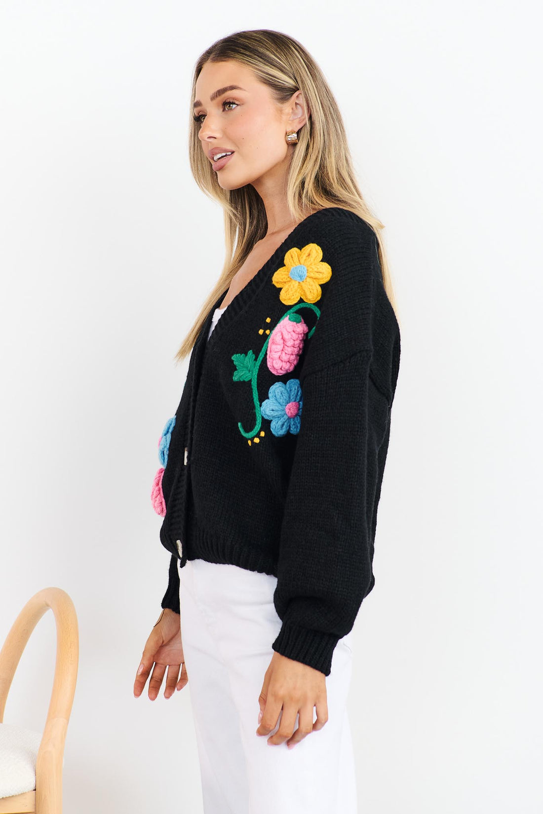 Side view of Lilah black Knit Cardigan with applique flowers
