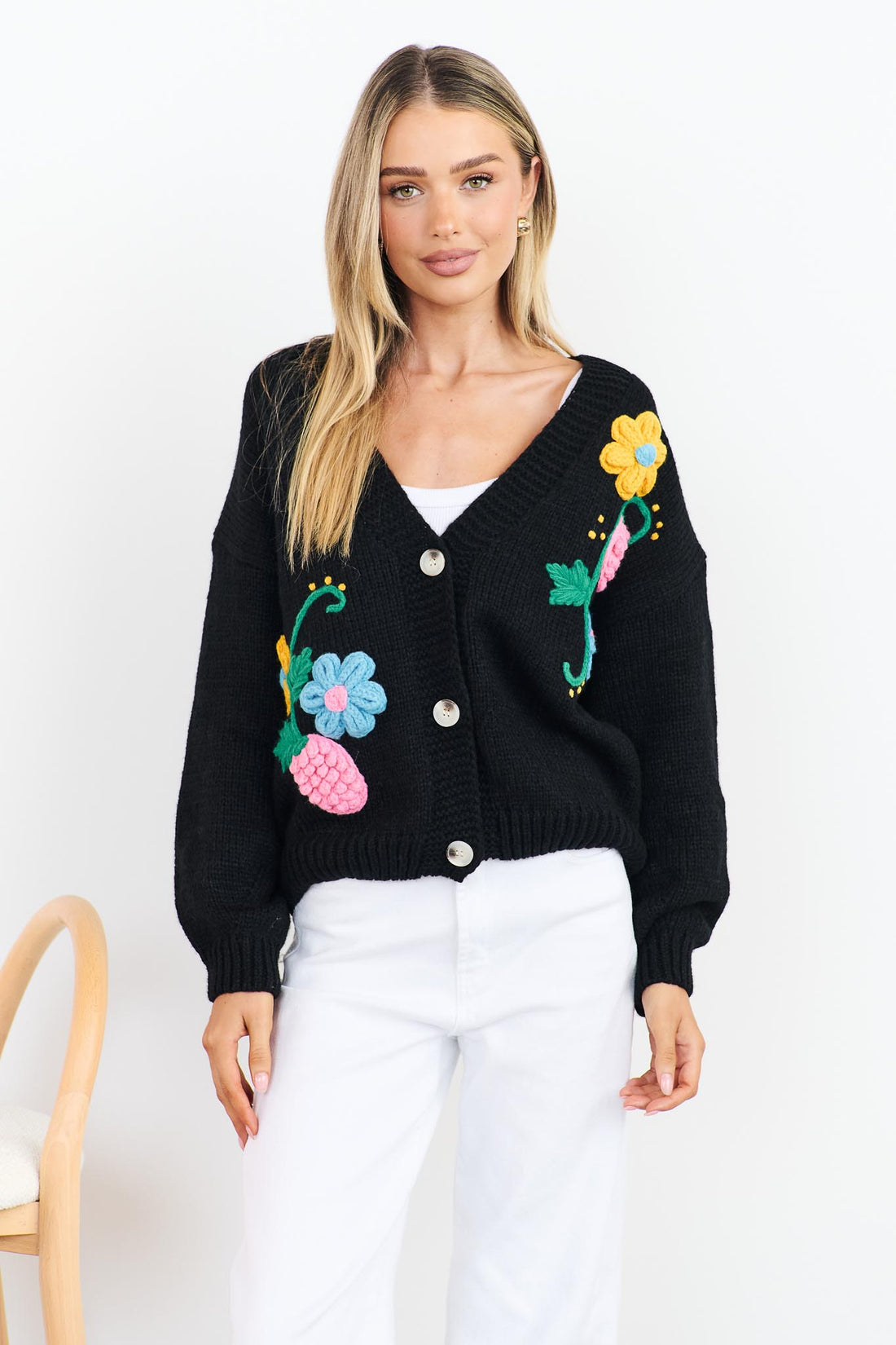 Lilah black Knit Cardigan with applique flowers and white jeans