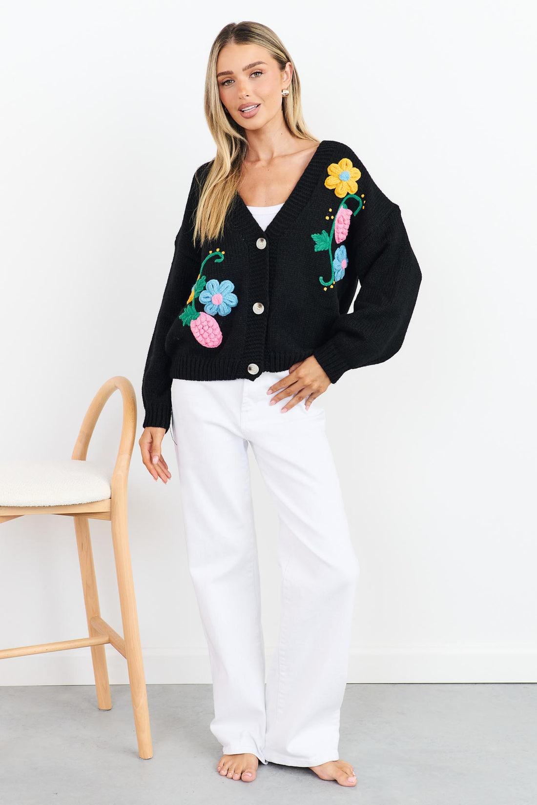 Lilah black Knit Cardigan with applique flowers and white jeans