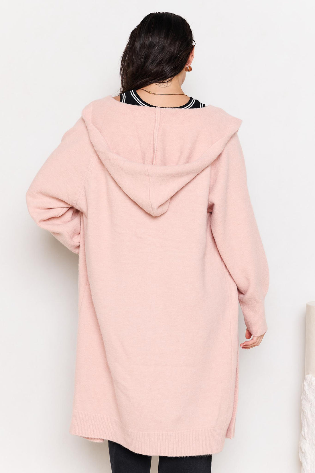 Back view of woman wearing the minnie + MAXXIE Lennox longline hooded cardi