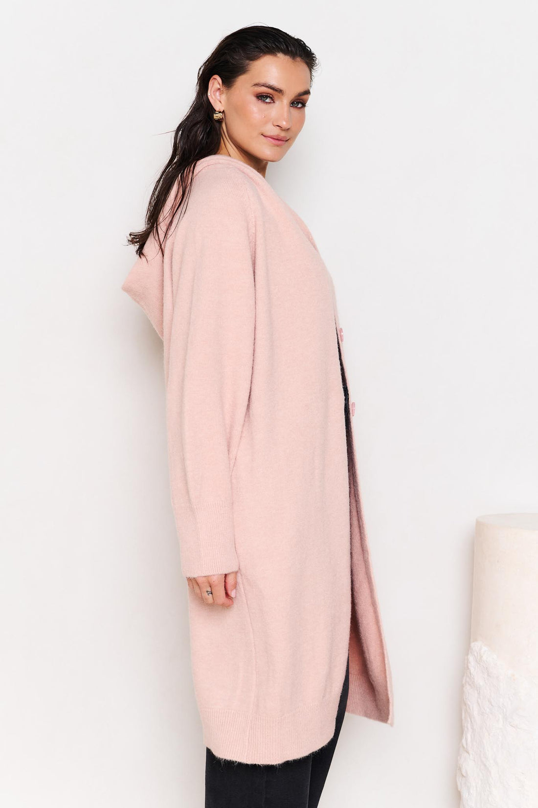Side view of woman wearing the minnie + MAXXIE Lennox longline hooded cardi