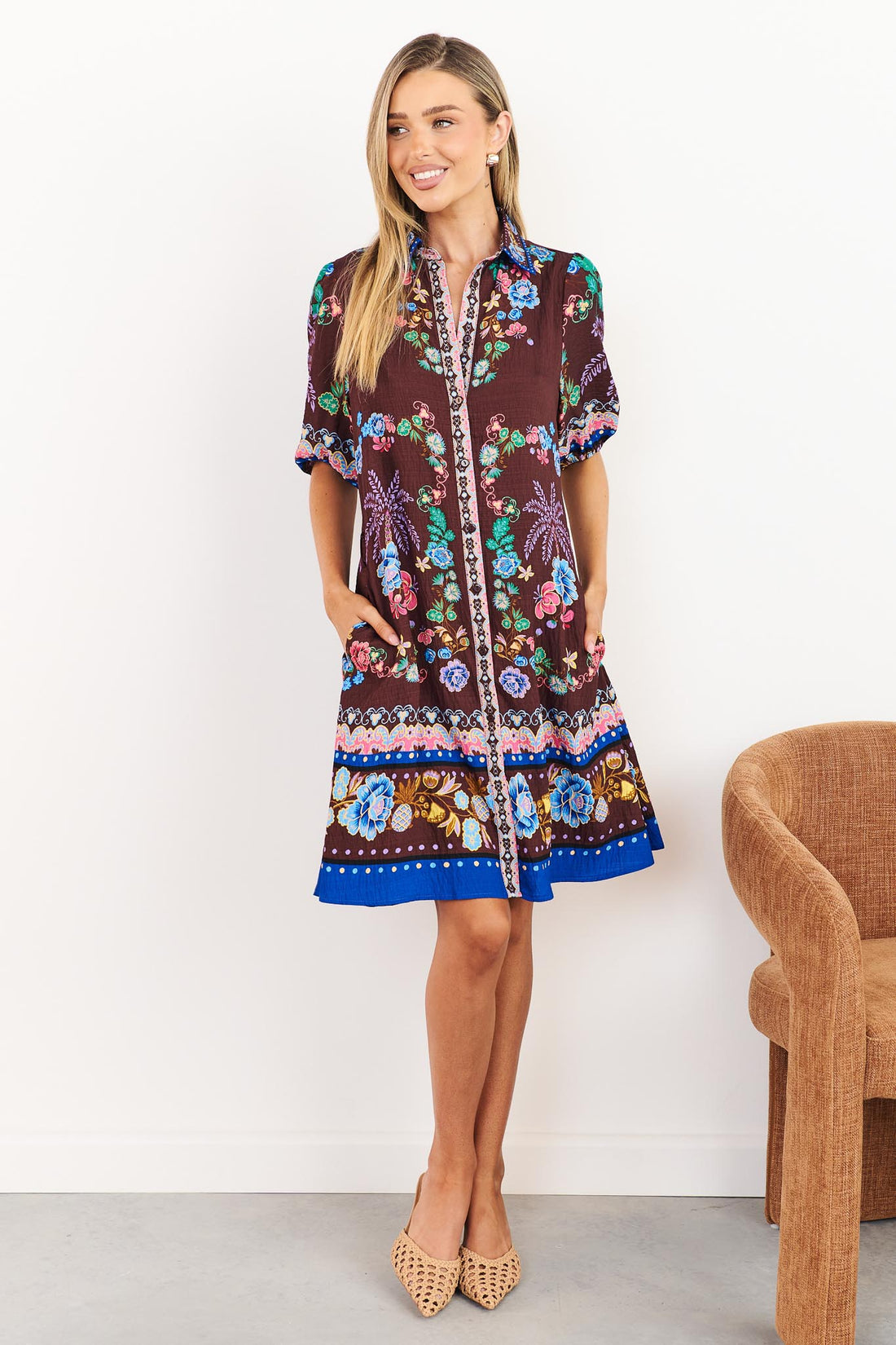 Margot dress in dark brown with floral print and side pockets