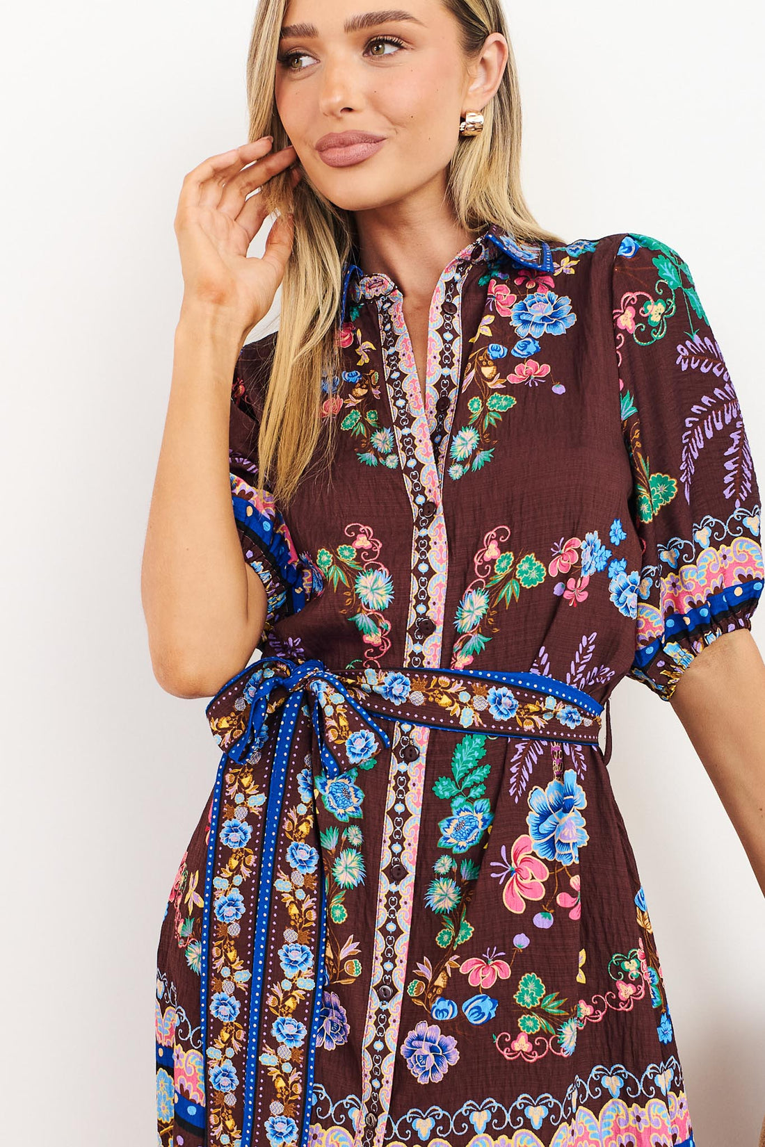 Detail of Margot dress in dark brown with floral print and matching waist tie