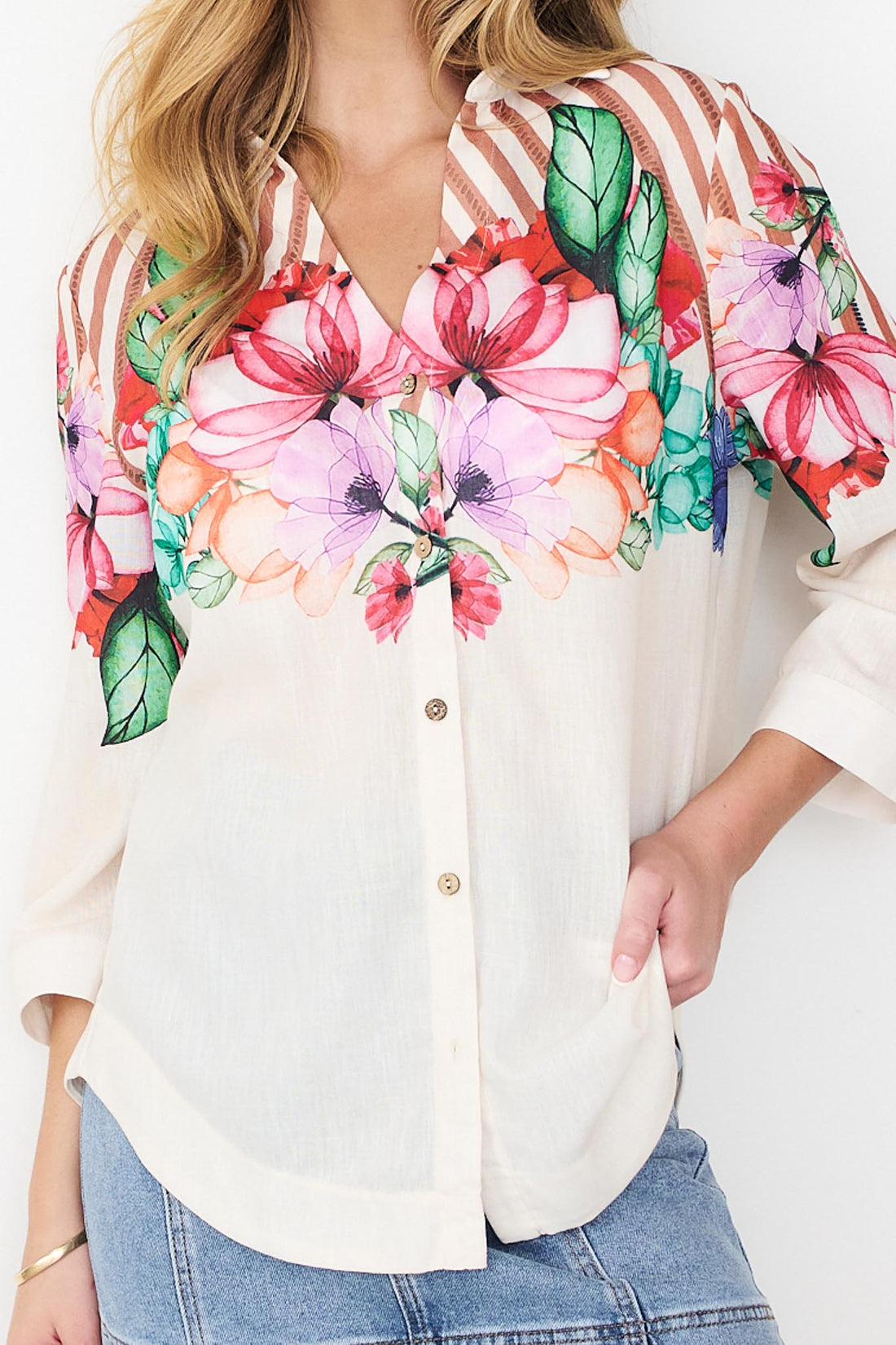 Detail of Mia Shirt in cinnamon with colourful floral patterns and stripes