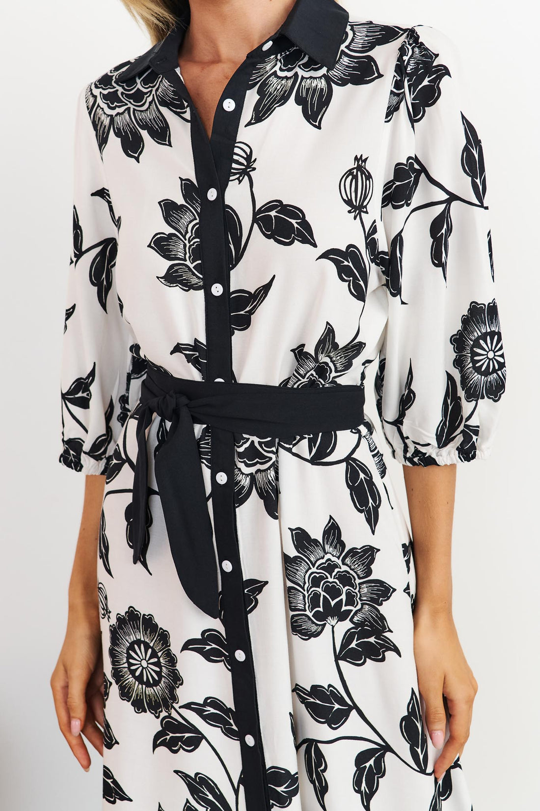 Detail of Rosa floral shirt dress in black and white with black waist tie