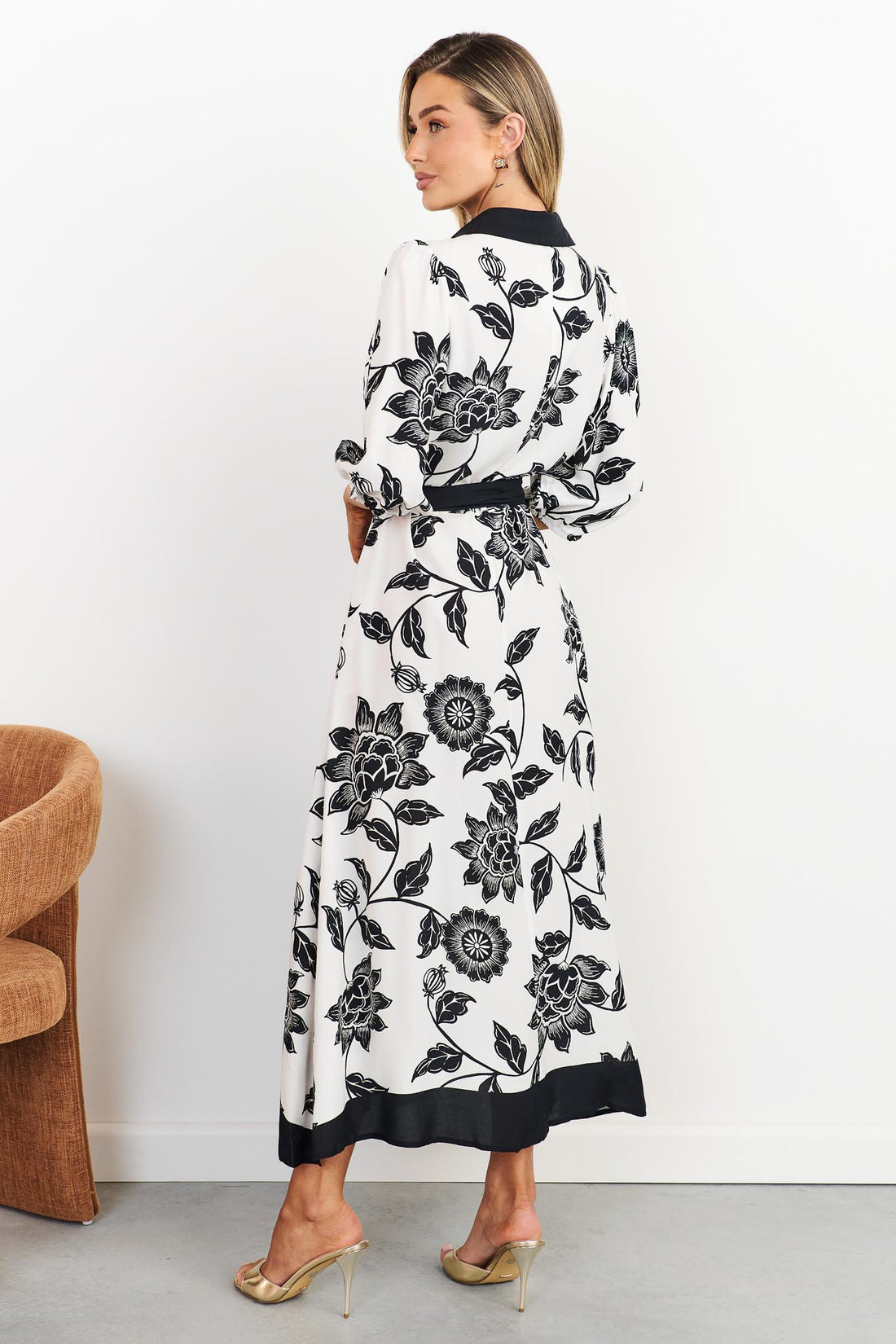 Back view of Rosa floral shirt dress in black and white with black waist tie