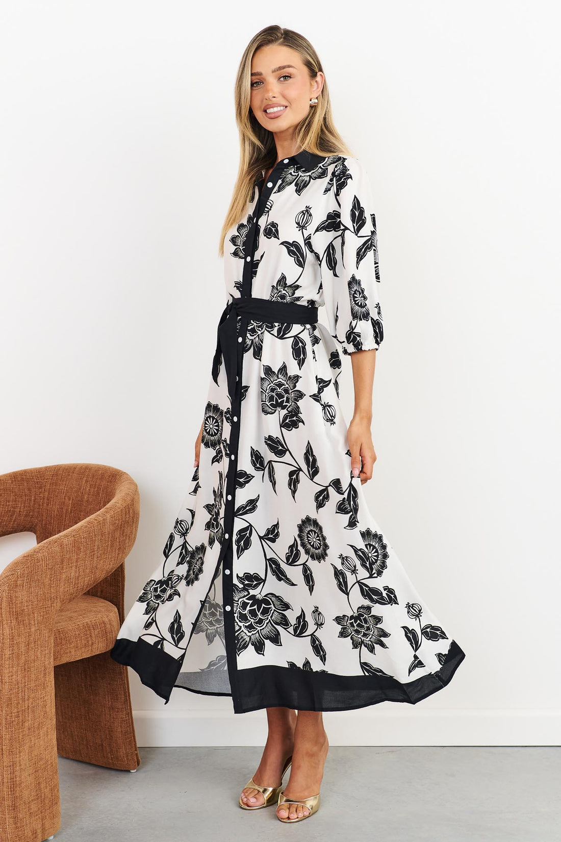Side view of Rosa floral shirt dress in black and white with black waist tie