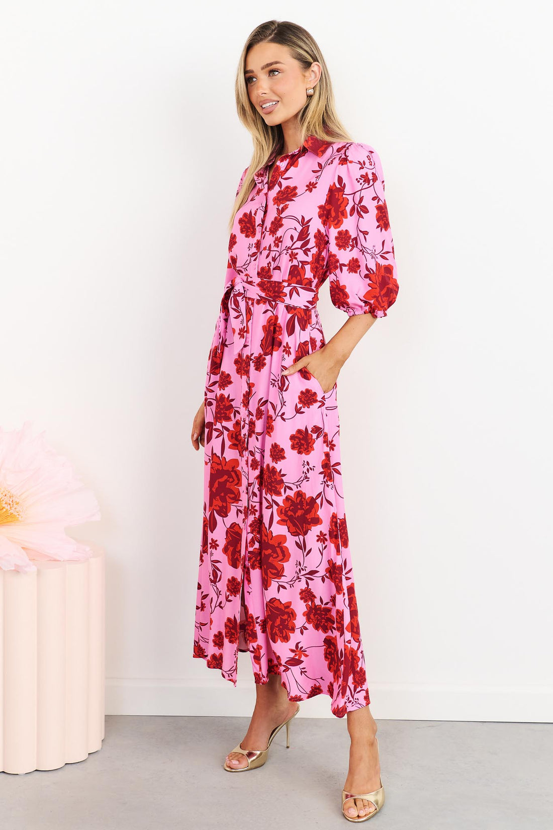 Side view of Rosa floral shirt dress in hot pink with matching waist tie