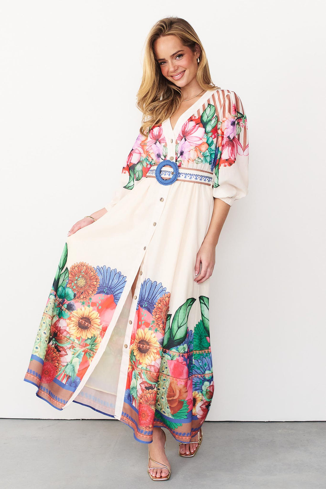 Rosabella maxi shirt dress with a bright floral and stripe print and a blue crochet buckle belt