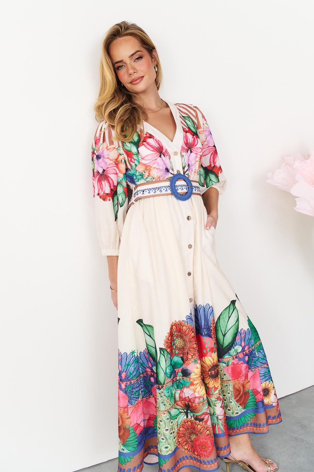 Rosabella maxi shirt dress with a bright floral and stripe print and blue crochet buckle belt