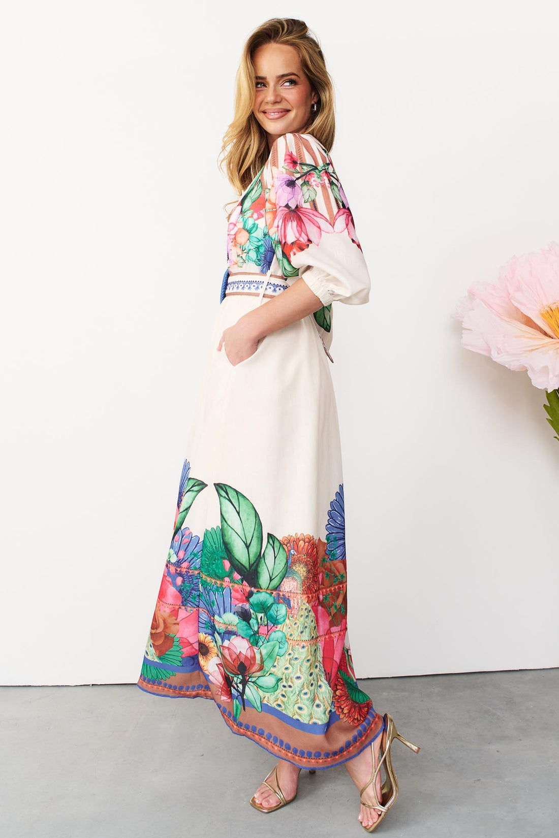 Side view of Rosabella maxi shirt dress with a bright floral and stripe print
