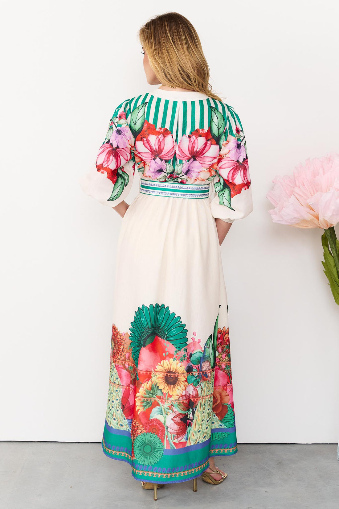 Back view of the Rosabella maxi shirt dress with a bright floral and stripe print