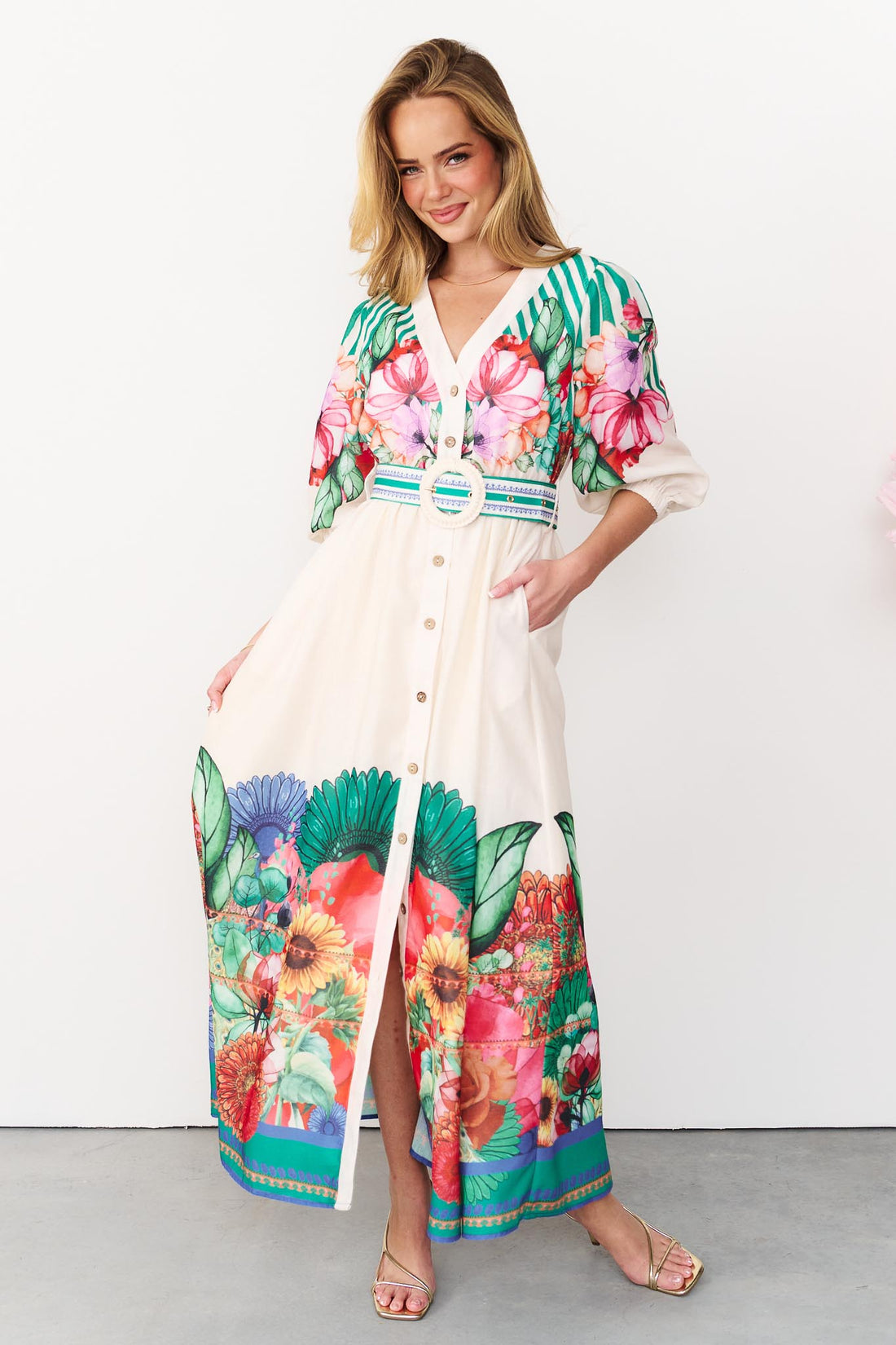 Rosabella maxi shirt dress with a bright floral and stripe print and white crochet buckle belt