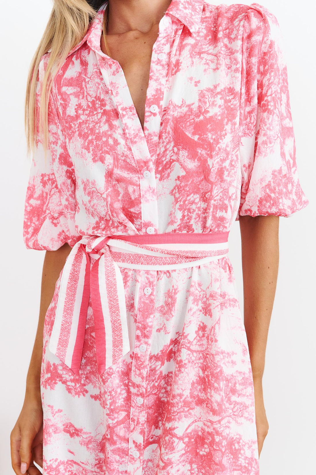 Detail of Pink toile print shirt dress with a pink stripe waist tie