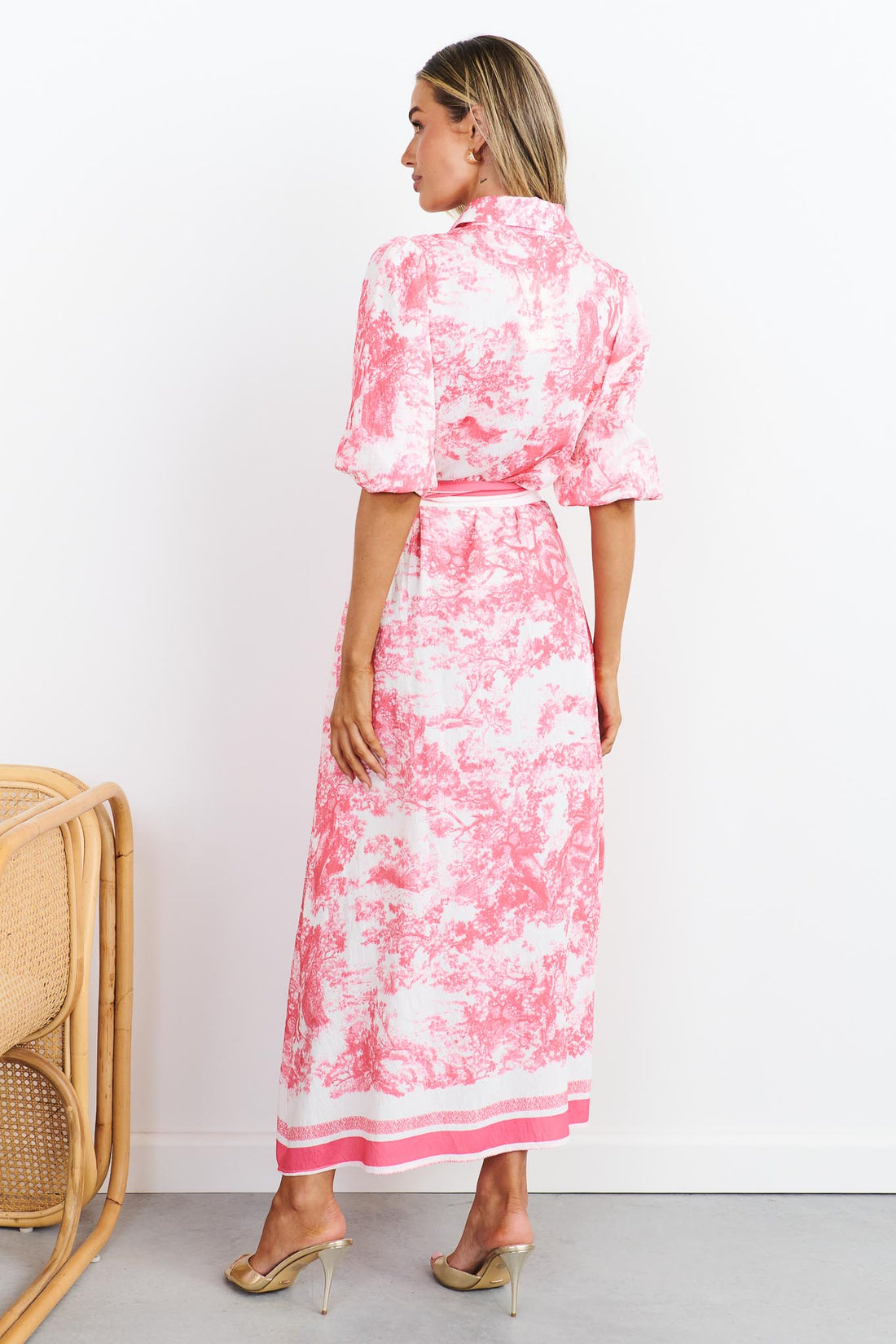 Back view of pink toile print shirt dress with a pink stripe waist tie
