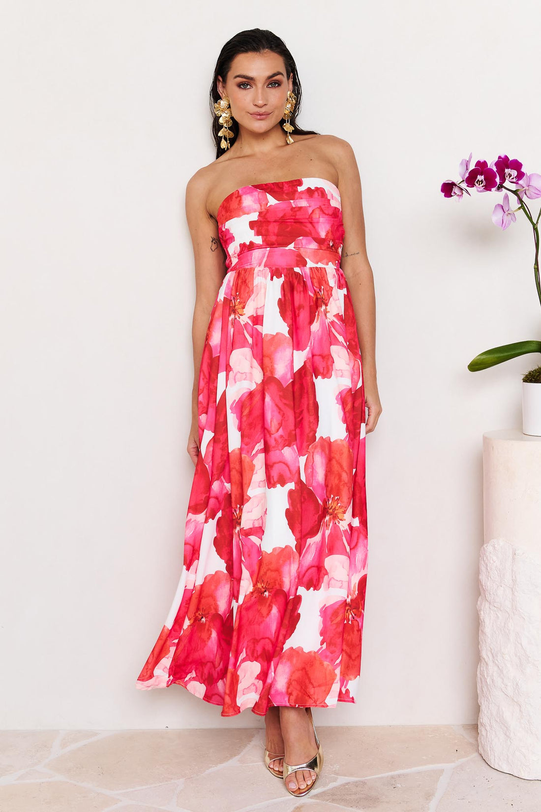 Woman wearing the minnie + MAXXIE Sienna Strapless pink floral event dress