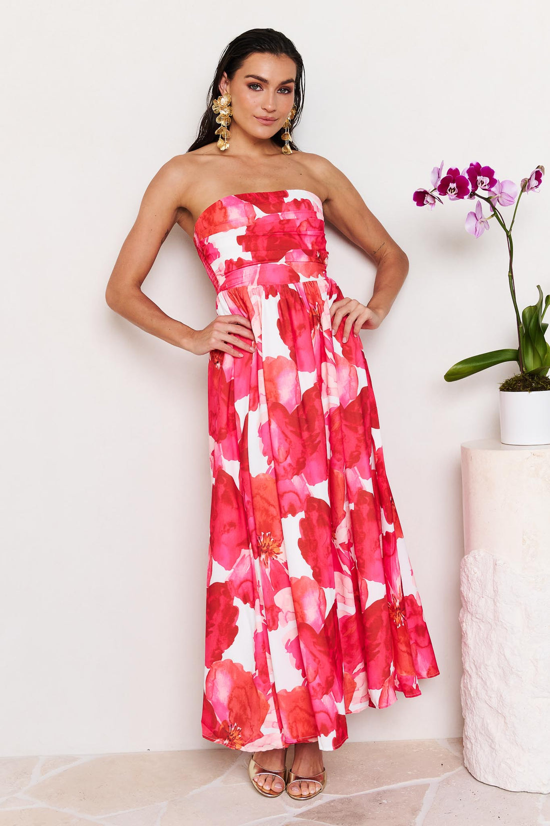 Woman wearing the minnie + MAXXIE Sienna Strapless pink floral event dress