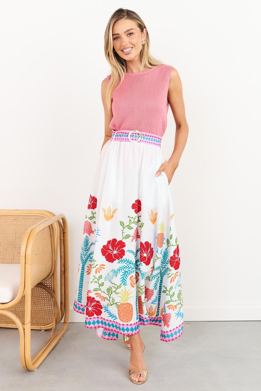 Valencia floral maxi skirt with pineapple print and matching belt, styled with pink Villa knit tank, full length