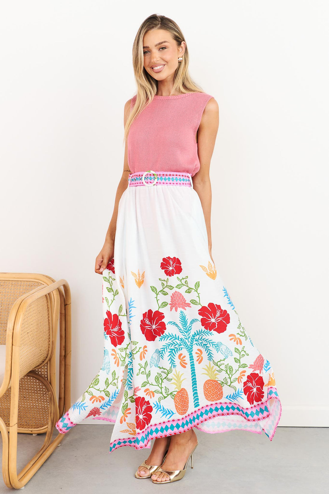 Valencia floral maxi skirt with pineapple print and matching belt, styled with pink Villa knit tank