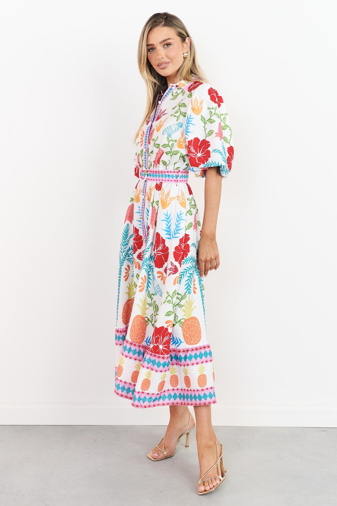 Valencia floral midi dress with pineapple print, short sleeves and matching belt, side view
